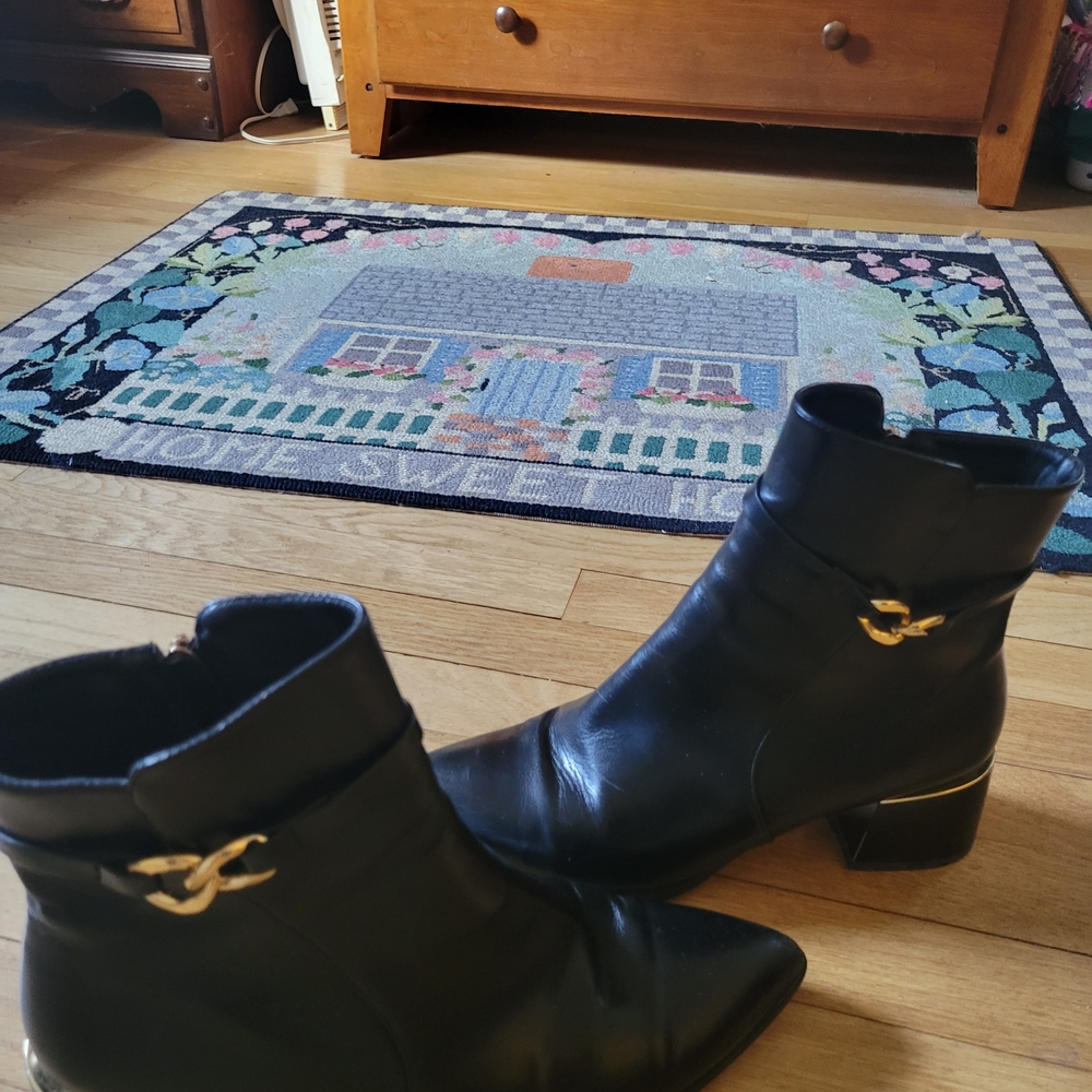 Torgeis Black Leather Ankle Boots with Gold Heel Accent